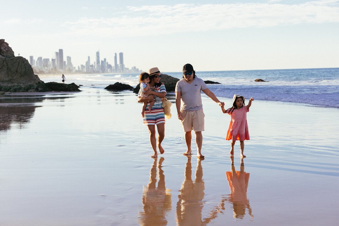 Family walking on the beach on the Gold Coast