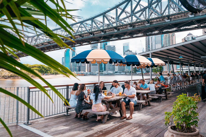 Image of people dining under the bridge at felons brewing Co in Brisbane
