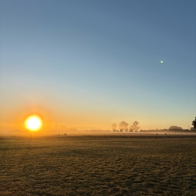 Afternoon sun setting on the horizon in St George, Queensland.