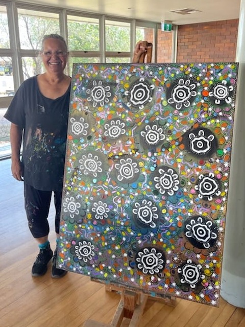 Artist Susie Klein with the 20 year forum artwork